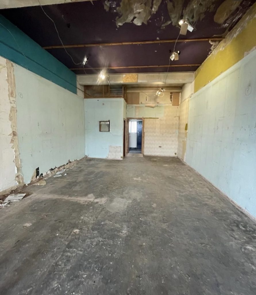a room with a broken ceiling